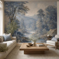 Blue forest wallpaper with powder blue river landscape and misty woodland trees for quiet luxury bedroom decor