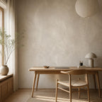 Neutral plaster wall mural installed in a serene minimalist living space with warm greige color palette