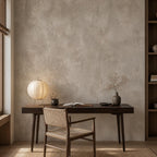 Corner detail of greige plaster wallpaper with soft tonal shifts evoking aged European walls and organic texture