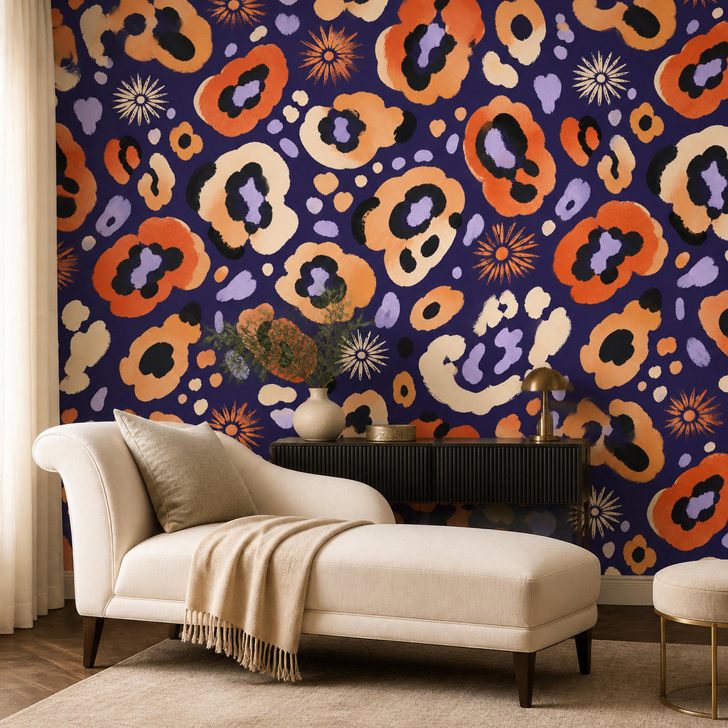 Indigo ocelot leopard print wallpaper in a lounge with a cream chaise and a black sideboard