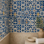 Hands peeling backing from removable cobalt zellige wallpaper to reveal adhesive layer
