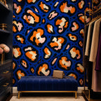 Cobalt leopard wallpaper in a dressing room with a navy tufted bench and clothing rail