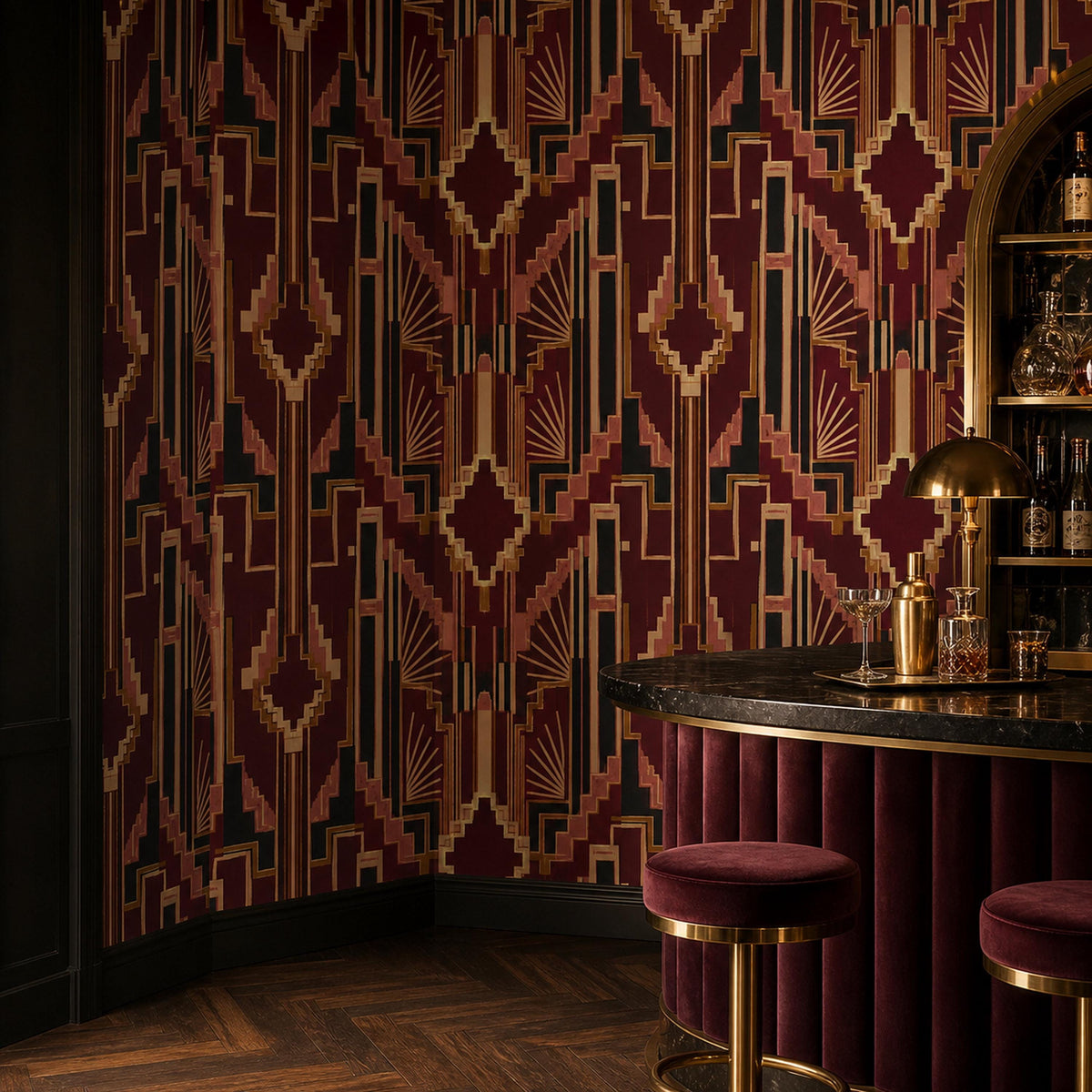 Burgundy Art Deco wallpaper in a home bar with a curved velvet counter, gold stools and brass lamp