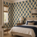 Navy herringbone wallpaper in a bedroom with a window, framed landscape print and navy bedding