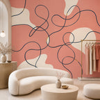 Full wall view of navy and coral continuous line art mural in a stylish gallery wall setting