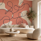 Peel and stick coral abstract mural shown in a living room with neutral furniture and warm lighting