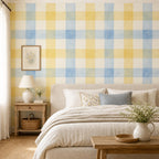 Cottage nursery decorated with blue gingham wallpaper creating a soft farmhouse style baby room accent wall