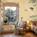 Full wall view of vintage floral crane mural wallpaper installed in a bright modern living room interior