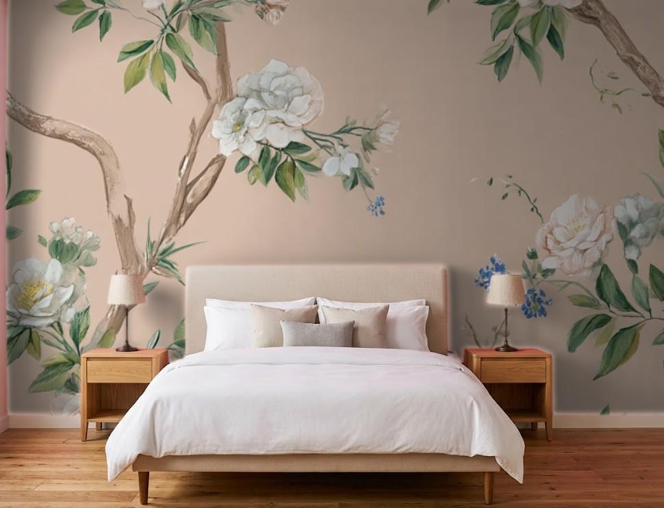 Single botanical wallpaper strip being applied to wall with smoothing tool for bubble-free installation
