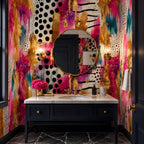 Abstract maximalist wall mural in pink and teal applied to a half wall behind a minimalist sofa