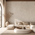 Living room accent wall featuring greige plaster wallpaper in a japandi inspired minimalist interior