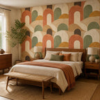 Boho bedroom feature wall covered in mid century arch wallpaper with terracotta and sage tones
