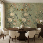 Bedroom wall displaying Asian inspired floral bird mural in soft sage green with layered peony branch detail