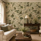 Sage frog botanical wallpaper in a living room with a cream sofa, dark wood coffee table and console