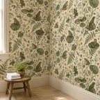 Sage frog botanical wallpaper in a corner with a small wooden stool and folded towels