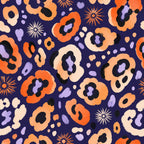 Indigo ocelot leopard print wallpaper flat view of orange, cream and lavender spots on a deep indigo ground