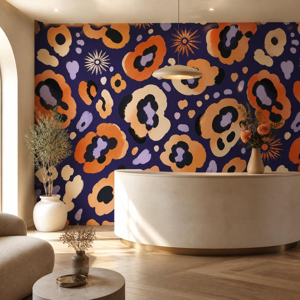 Indigo ocelot leopard print wallpaper in a reception area with a curved cream desk and pendant light