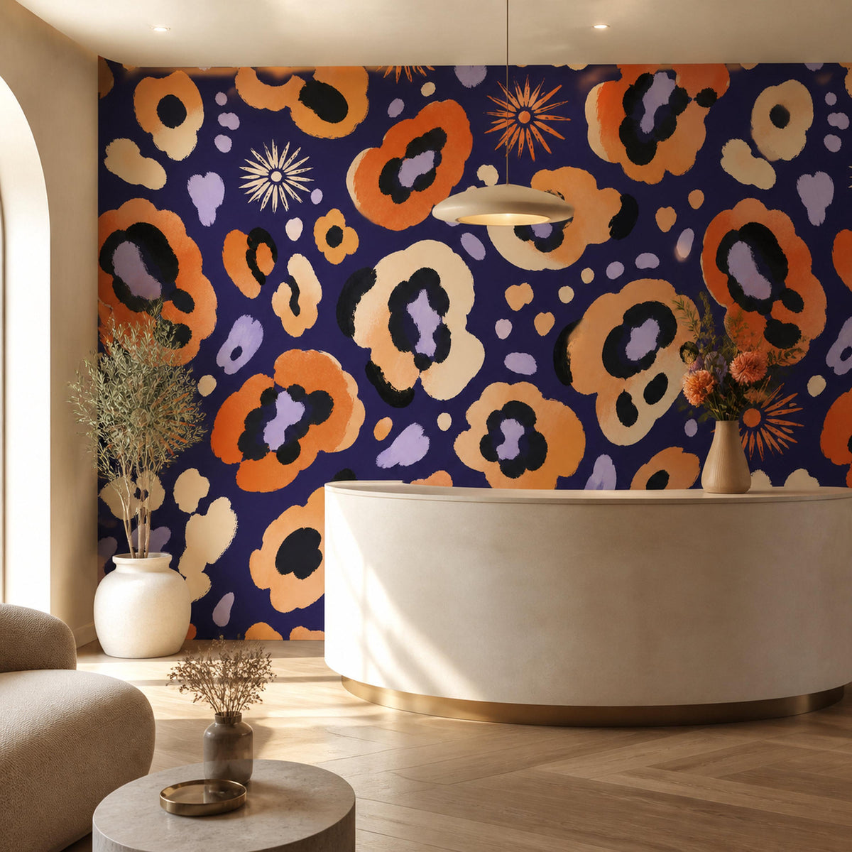 Indigo ocelot leopard print wallpaper in a reception area with a curved cream desk and pendant light