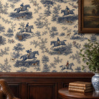 Cobalt blue equestrian toile wallpaper close-up above dark wood paneling with books and a blue and white jar