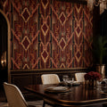 Burgundy Art Deco wallpaper in a dining room with a dark wood table, cream chairs and wood paneling