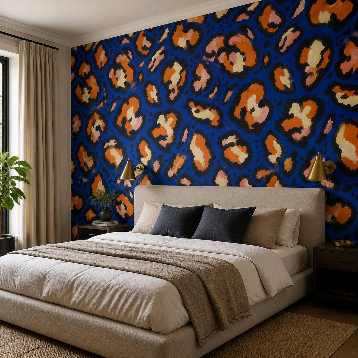Cobalt leopard wallpaper in a bedroom with gray bedding and black pillows