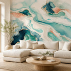 Teal abstract wave wallpaper mural in a living room with a cream sectional and round wooden coffee table