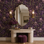 Art Nouveau iris wallpaper in a dressing area with a scalloped mirror, stone vanity and velvet stool