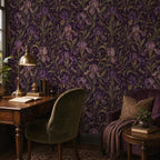 Art Nouveau iris wallpaper in a study with a wooden desk, green velvet chair and brass lamp