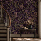 Art Nouveau iris wallpaper in a hallway with a curved staircase, console table and dried flowers