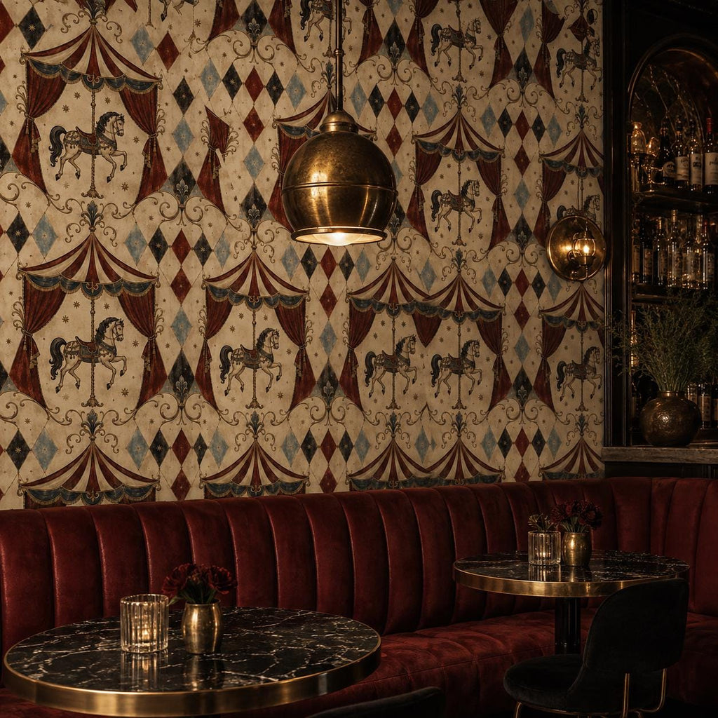 Oxblood harlequin circus wallpaper in a bar lounge with a red velvet banquette, marble tables and brass pendant