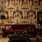 Oxblood harlequin circus wallpaper in a living room with a red velvet sofa and dark coffee table