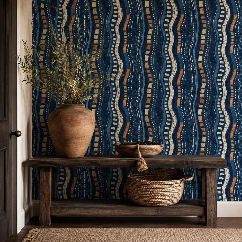 Afrohemian indigo mudcloth wallpaper in an entryway with a rustic wooden console, clay vase and woven basket
