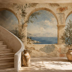 Greek fresco Aegean arch mural beside a curved stone staircase with a terracotta urn and olive tree