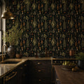 Kitchen witch dark botanical wallpaper in a kitchen with a brass pendant, dark cabinets and marble countertop