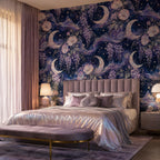 Celestial moon and wisteria wallpaper in a bedroom with a pink upholstered bed and iridescent bedding