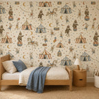 Vintage circus nursery wallpaper behind a wooden daybed with a blue throw and round side table