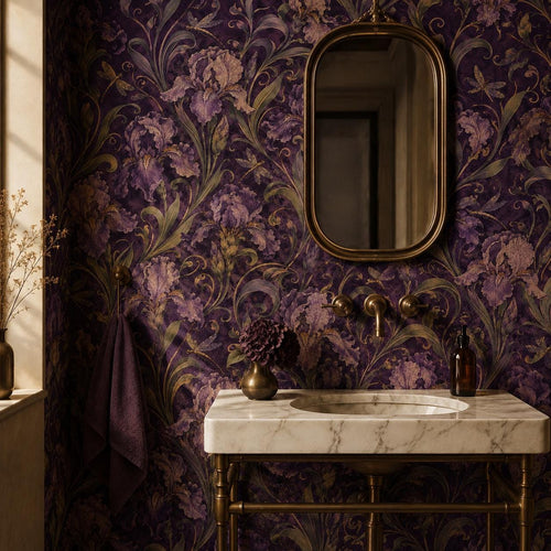 Art Nouveau iris wallpaper in a powder room with a marble vanity, brass faucet and oval mirror