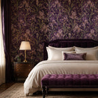 Art Nouveau iris wallpaper in a bedroom with a velvet headboard, white bedding and purple tufted bench