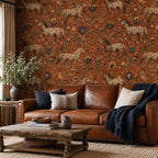 Terracotta folk art horse wallpaper in a living room with a brown leather sofa and rustic wooden coffee table