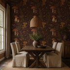 Dark plum mushroom toile wallpaper in a dining room with a farmhouse table and linen slipcovered chairs