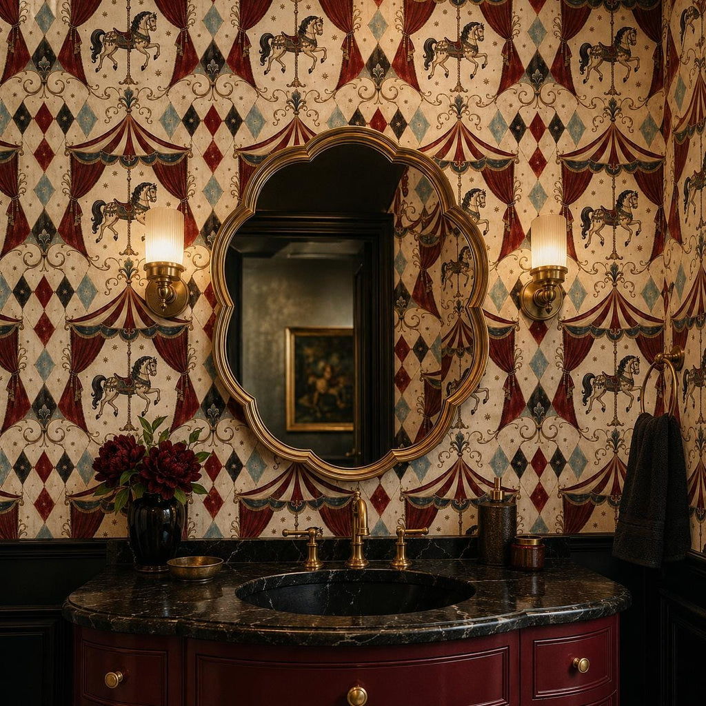 Oxblood harlequin circus wallpaper in a powder room with a dark marble vanity and ornate gold mirror