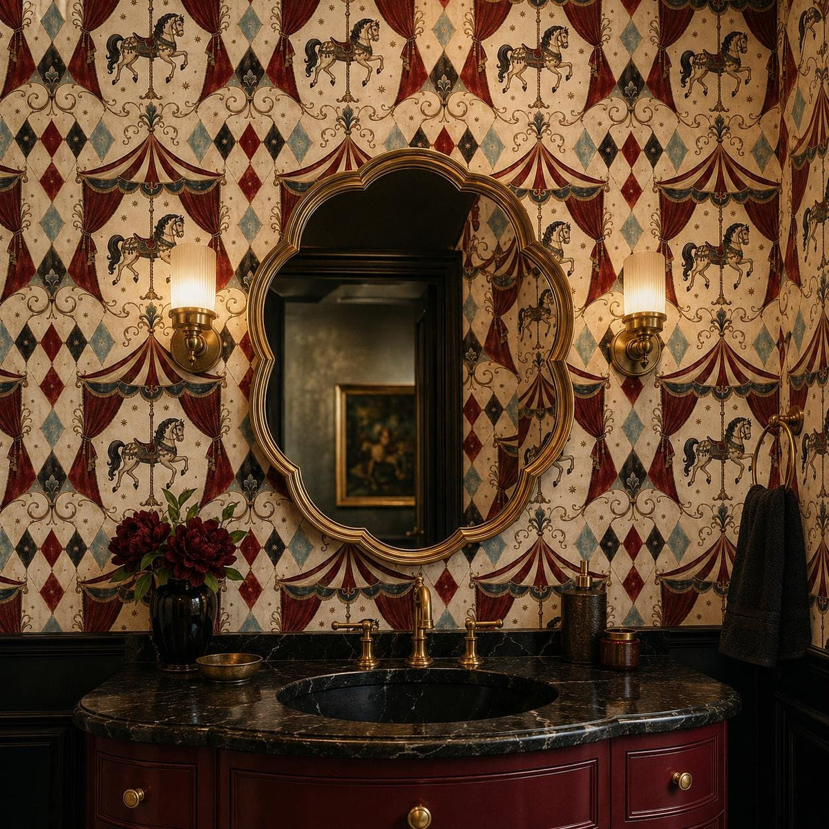 Oxblood harlequin circus wallpaper in a powder room with a dark marble vanity and ornate gold mirror