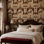Oxblood harlequin circus wallpaper behind a dark wooden bed with a red tufted bench