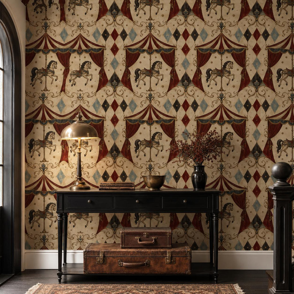 Oxblood harlequin circus wallpaper in a hallway with a black console, brass lamp and vintage suitcase