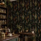Kitchen witch dark botanical wallpaper in a pantry with shelves of glass jars and a teapot on the counter