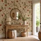 Pressed flower wallpaper in an entryway with a wooden console, round mirror and woven baskets